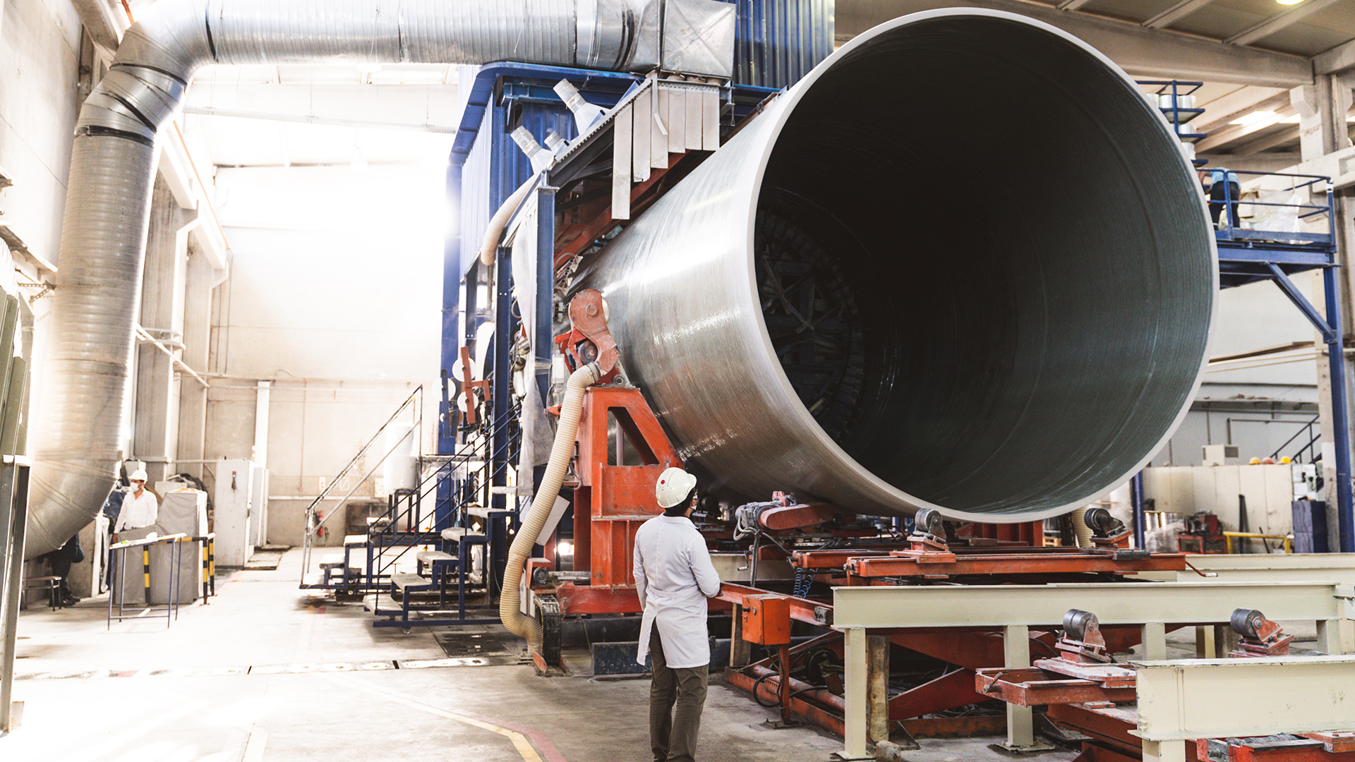 Large industrial construction project with cranes and building infrastructure